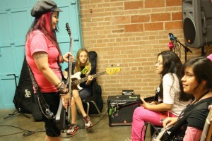 Bass instruction with Rah Stitchez and Kelly Hnot at Girls Rock Dallas. 